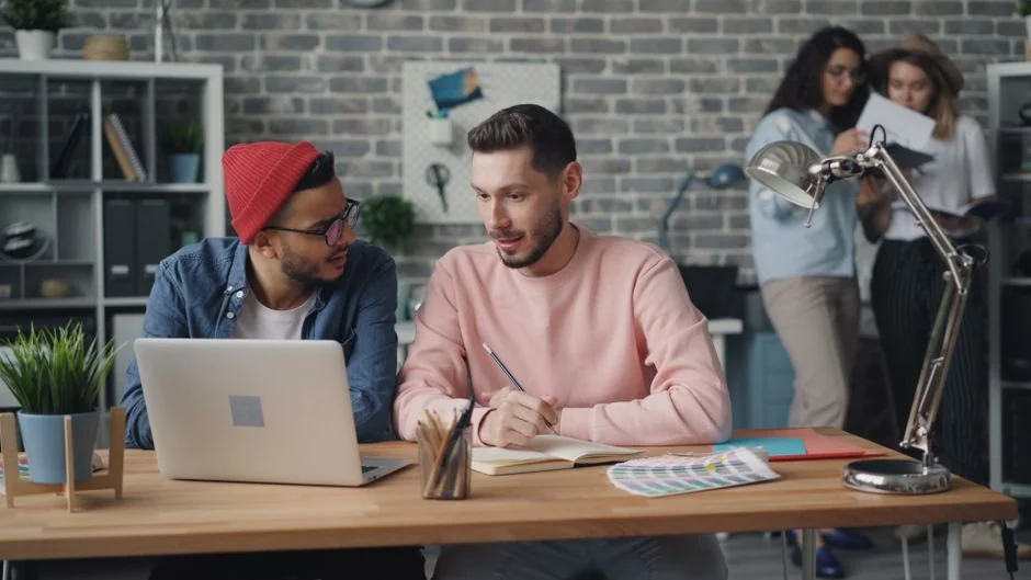 A contemporary workspace showcasing a laptop, tablet, and smartphones, ideal for tech and freelance use.
